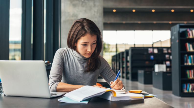 student studying in library