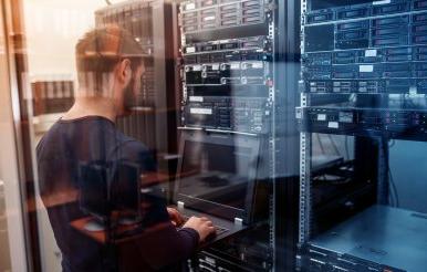 network engineer working in server room