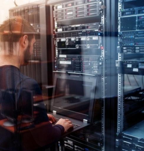 network engineer working in server room